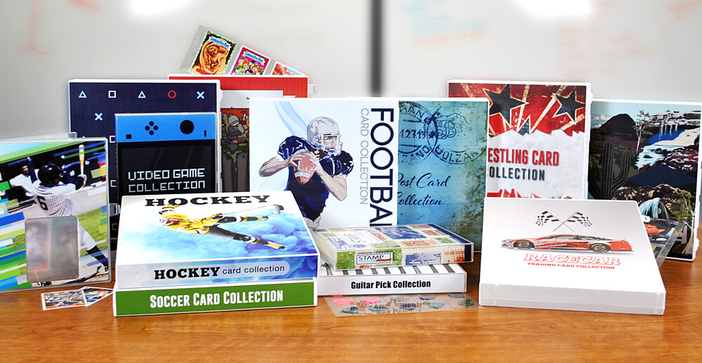 A collection of 3 ring binders, sports card binders and trading card binders on display on a table top